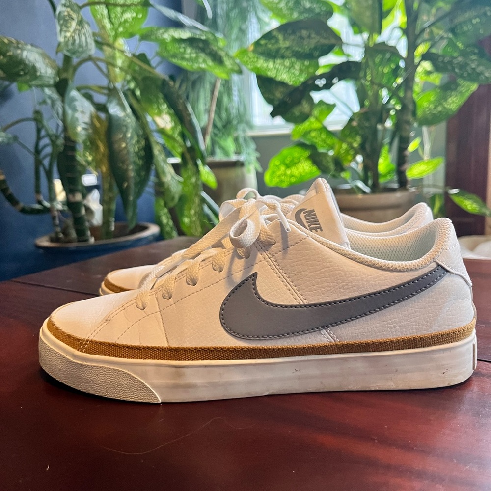 Nike Women's White and Gray Sneakers with Gold Accent